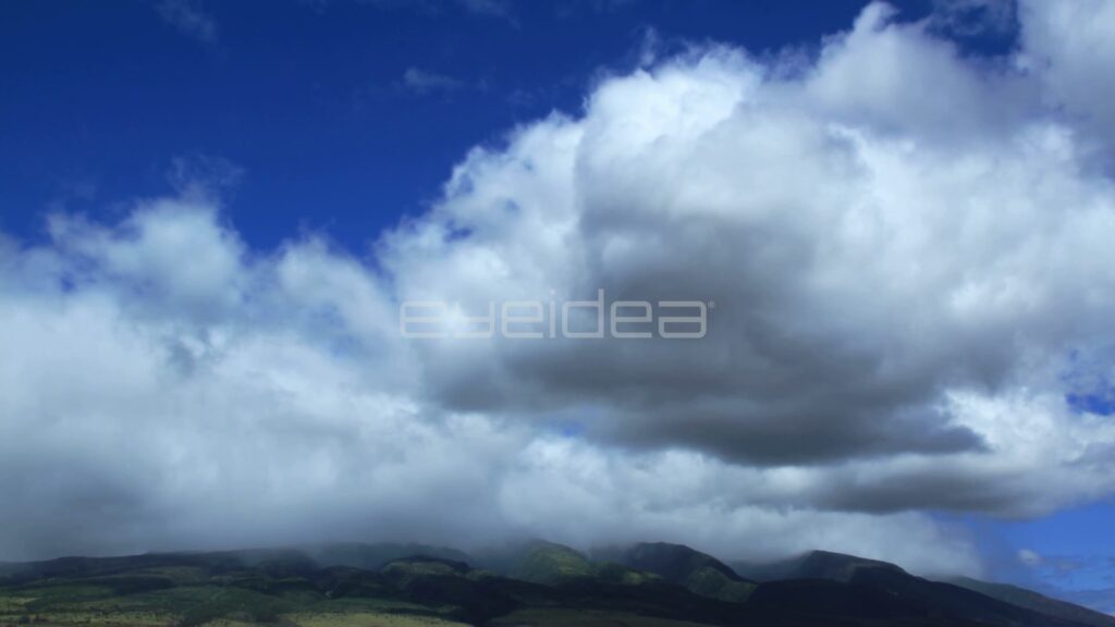 Time-Lapse of White Clouds over Maui Mountains in Blue Sky
