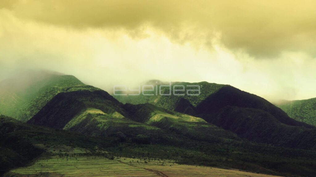 Time-Lapse of Clouds over Green Maui Ridges in Golden Haze