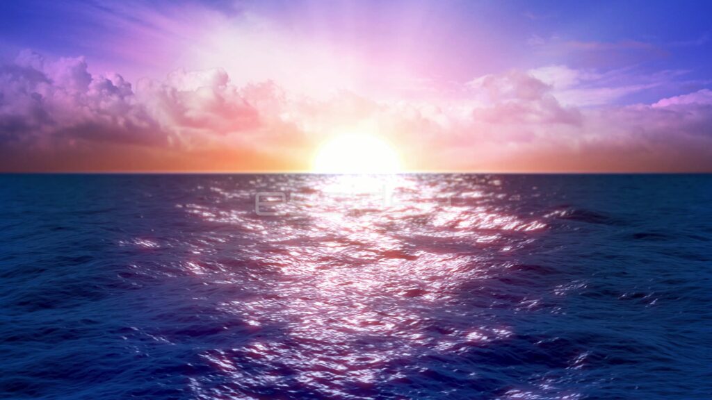 Sun Setting Over Ocean Under a Purple and Pink Sky