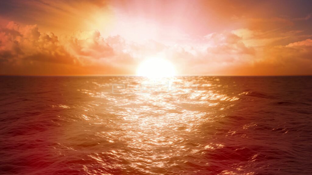 Golden Sunset Over Rippling Ocean Waves with Clouds
