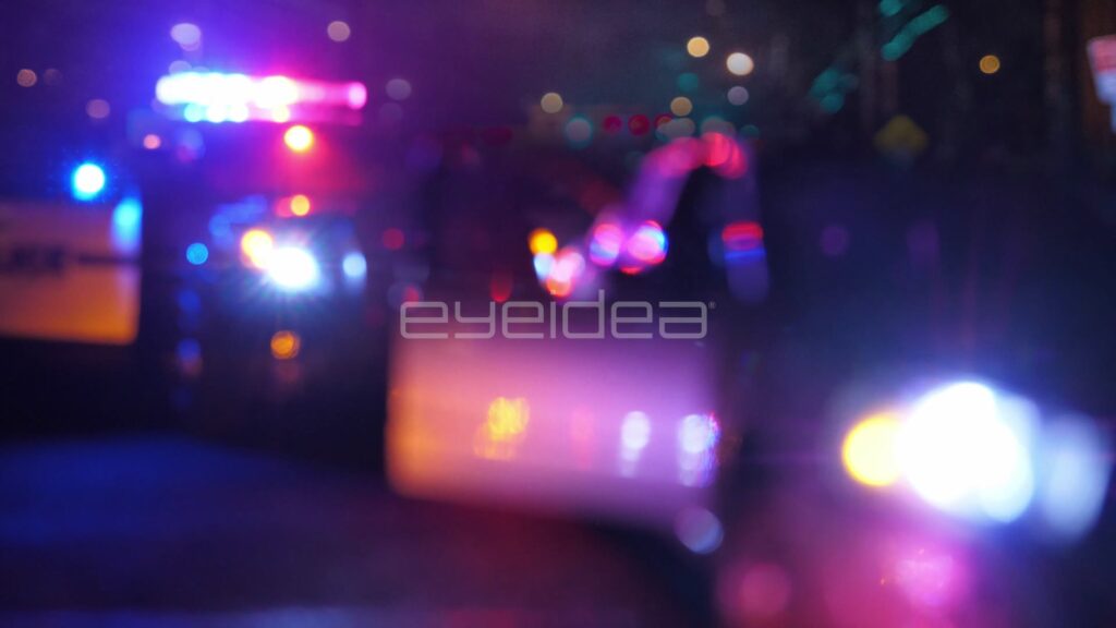 Defocused Police Traffic Stop with Glaring Headlights