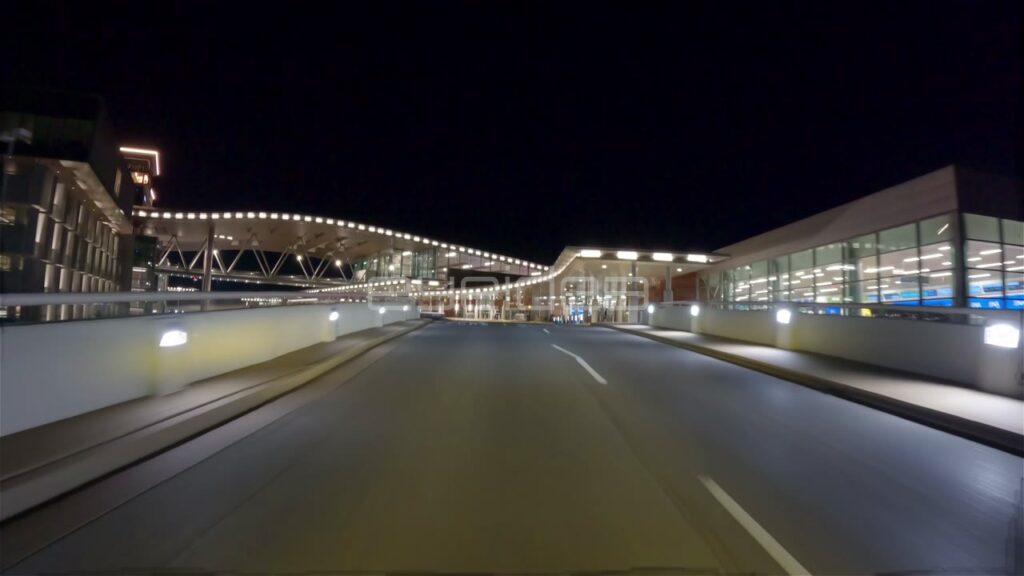 Driving POV Past BNA Airport Departures Terminal at Night