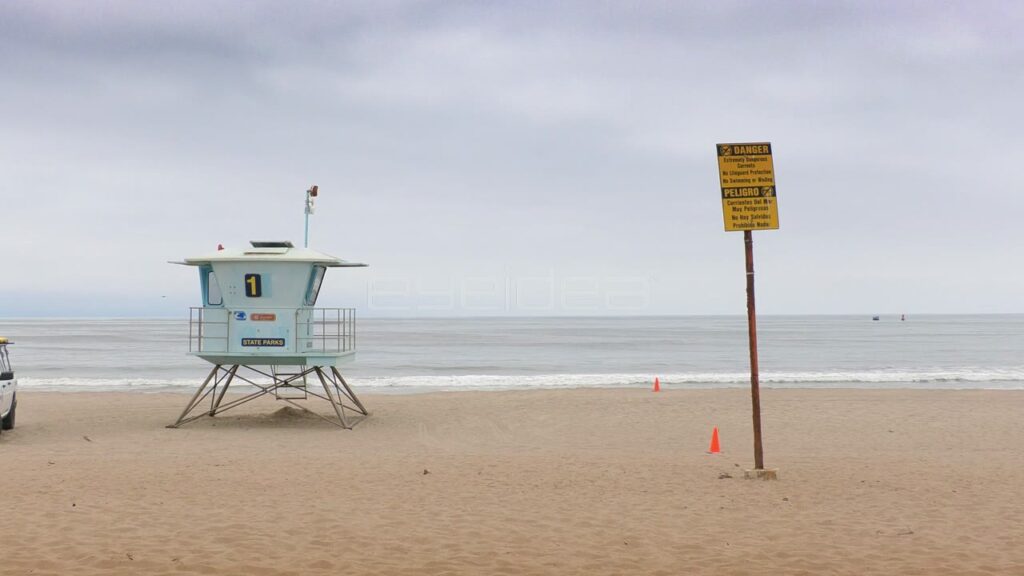 Lifeguard Truck Drives Away from Tower on State Beach