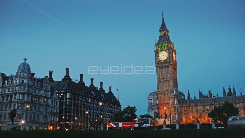 Big Ben at Dusk with Red Bus Passing
