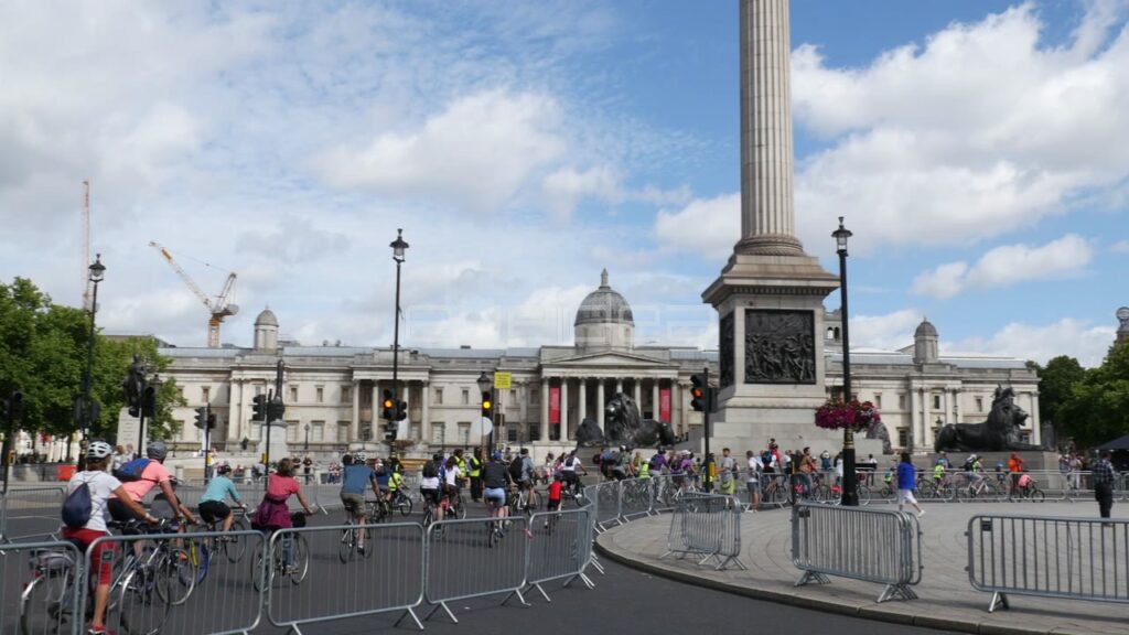 Cyclists Ride in Front of National Gallery in London