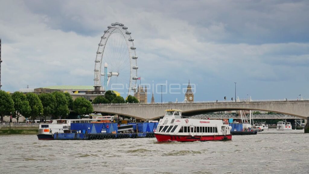 London Eye and Tour Boat on the River Thames