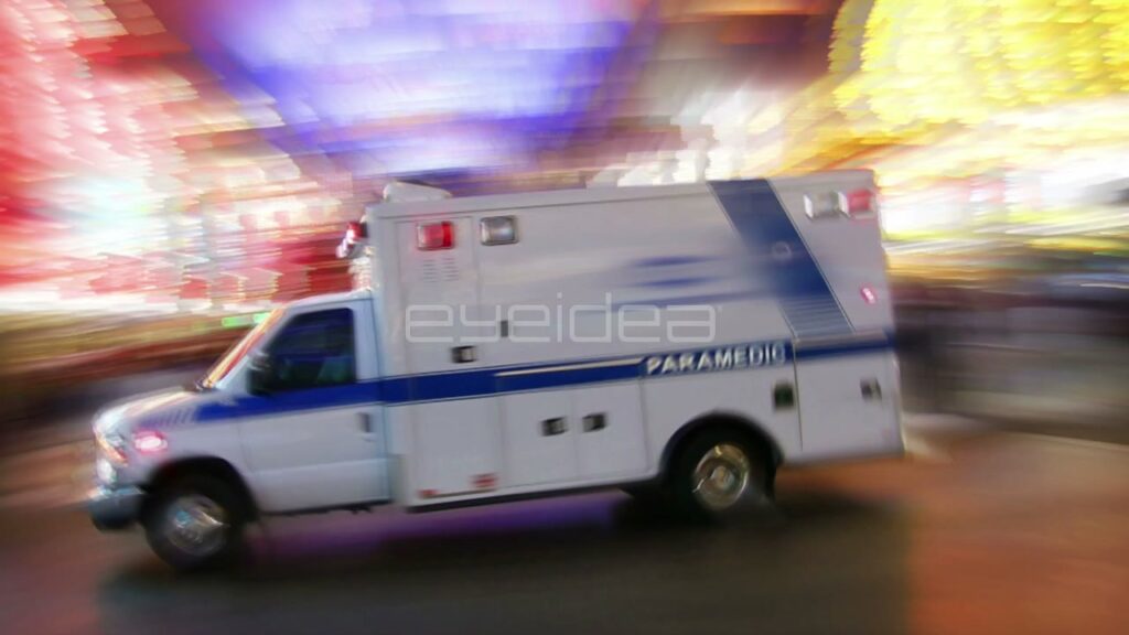 Ambulance Driving Fast through Downtown Las Vegas at Night