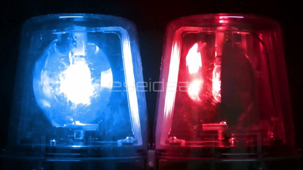 Flashing Blue and Red Emergency Warning Lights on Black Background