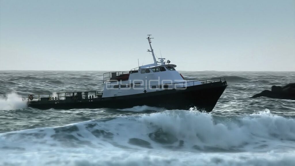 Medium Sized Boat Navigating through Rough Ocean Waves