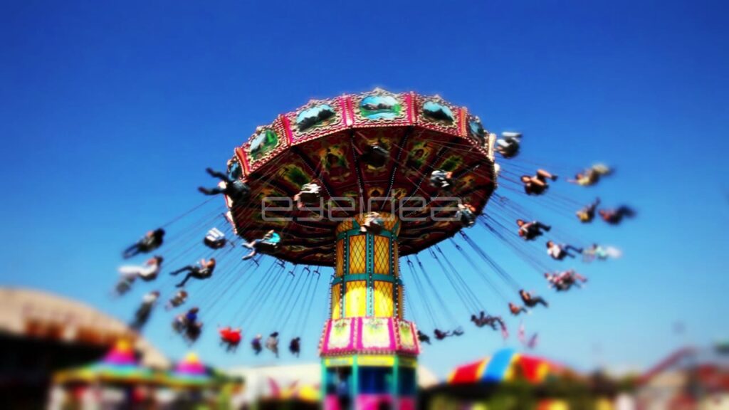 Low Angle View of Colorful Swing Ride at Carnival