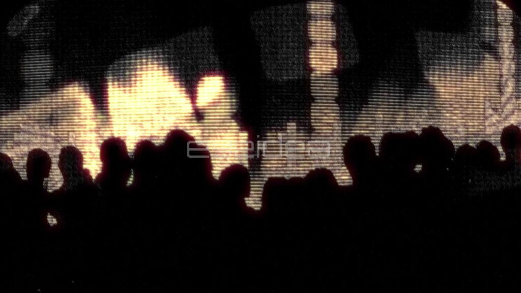 Silhouettes of People Dancing in Front of Golden Light