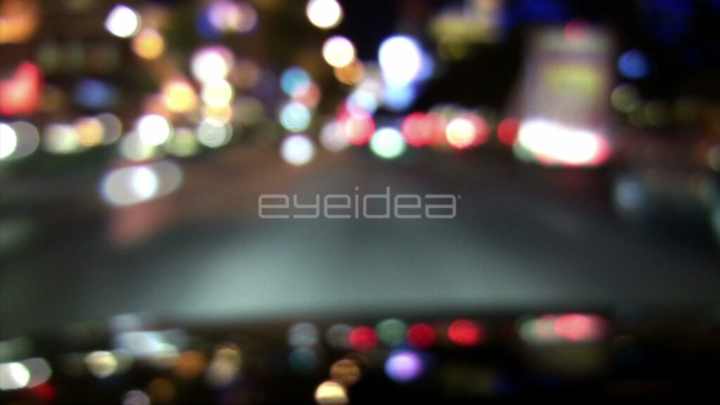 Defocused POV Driving through City Streets at Night