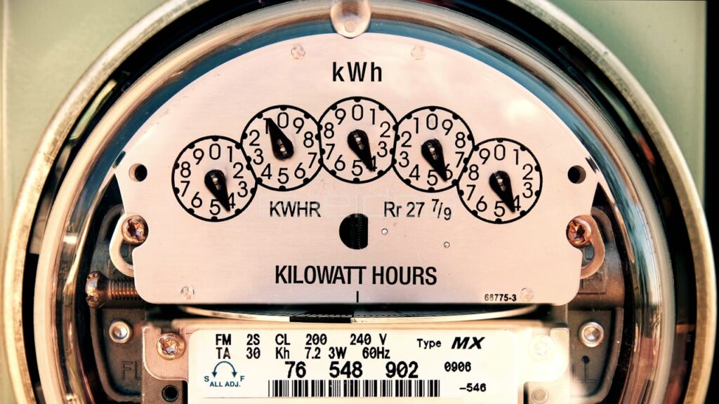 Time-Lapse of Spinning Electricity Meter Dials in Close-Up