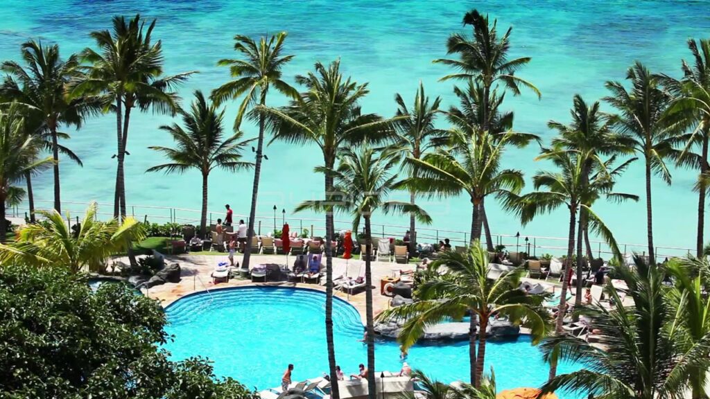Aerial View of Tropical Resort Pool and Turquoise Ocean