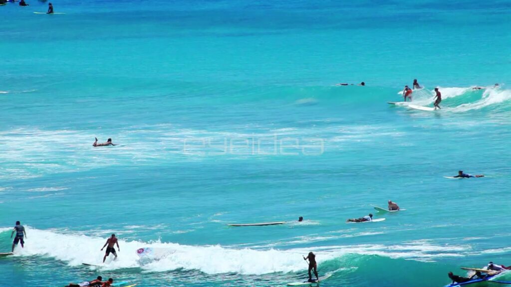 Surfers Riding Waves in Turquoise Ocean Water