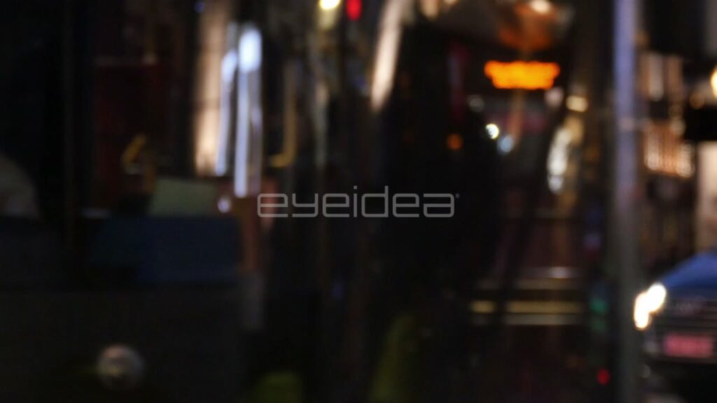 Busy London Street Scene with Red Buses in Soft Bokeh