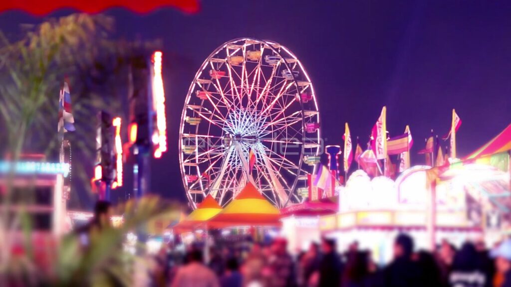 Ferris Wheel and Carnival Rides at Night with Bokeh