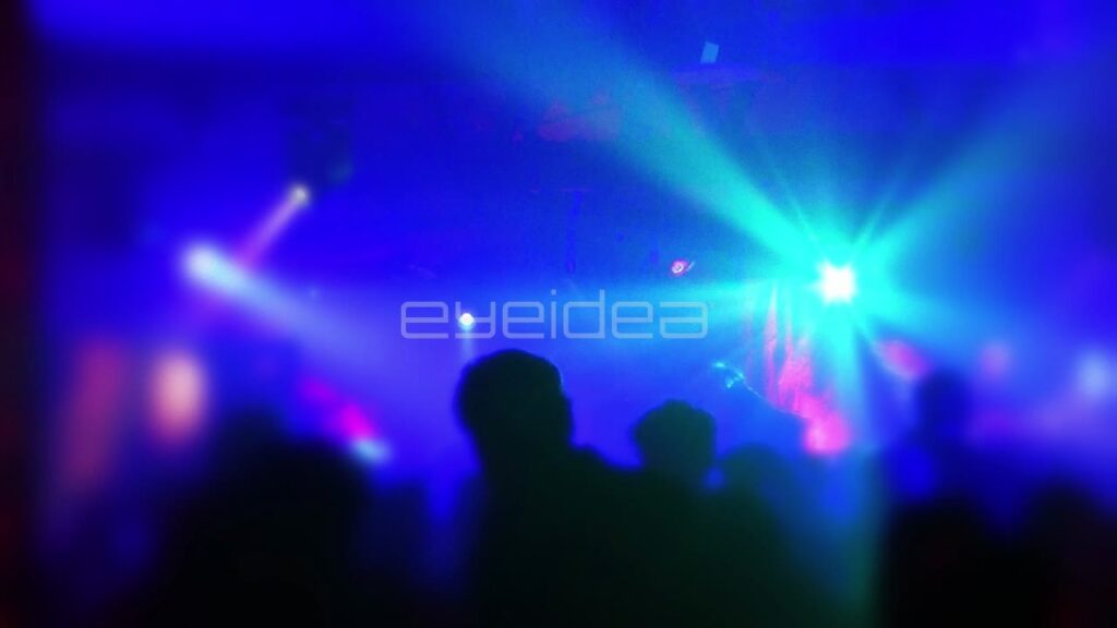 Crowd Dancing in Nightclub with Blue and Cyan Lights