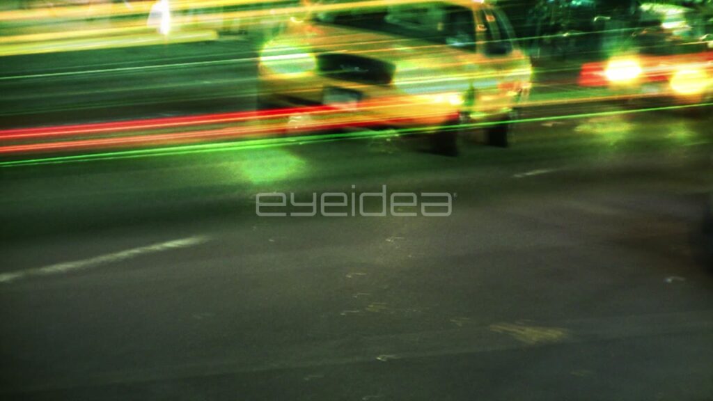 Yellow Taxis Speeding through Nighttime New York City Streets