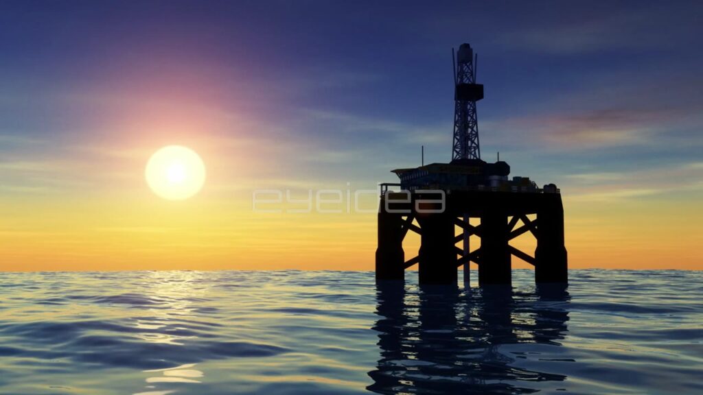 Offshore Oil Rig Silhouette at Sunset in Blue and Gold