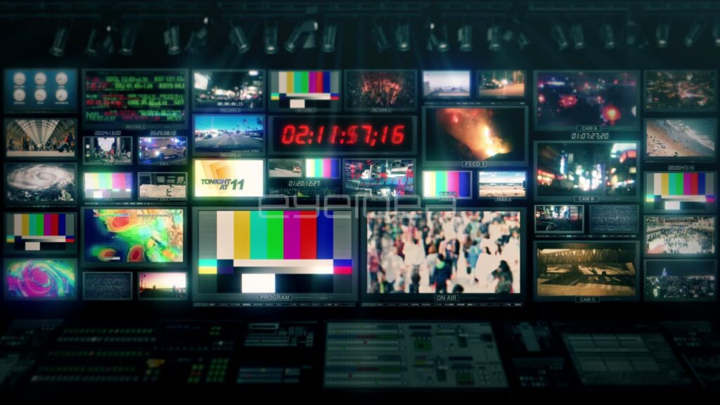 Multiple Video Monitor Screens in Dark News Control Room