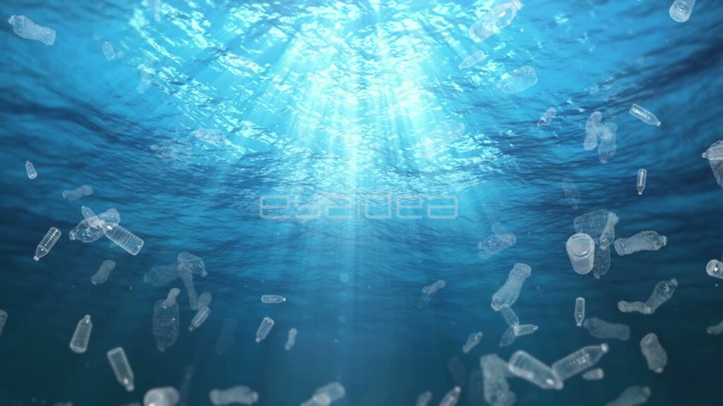 Plastic Bottles Floating in Blue Underwater Sunlight Rays