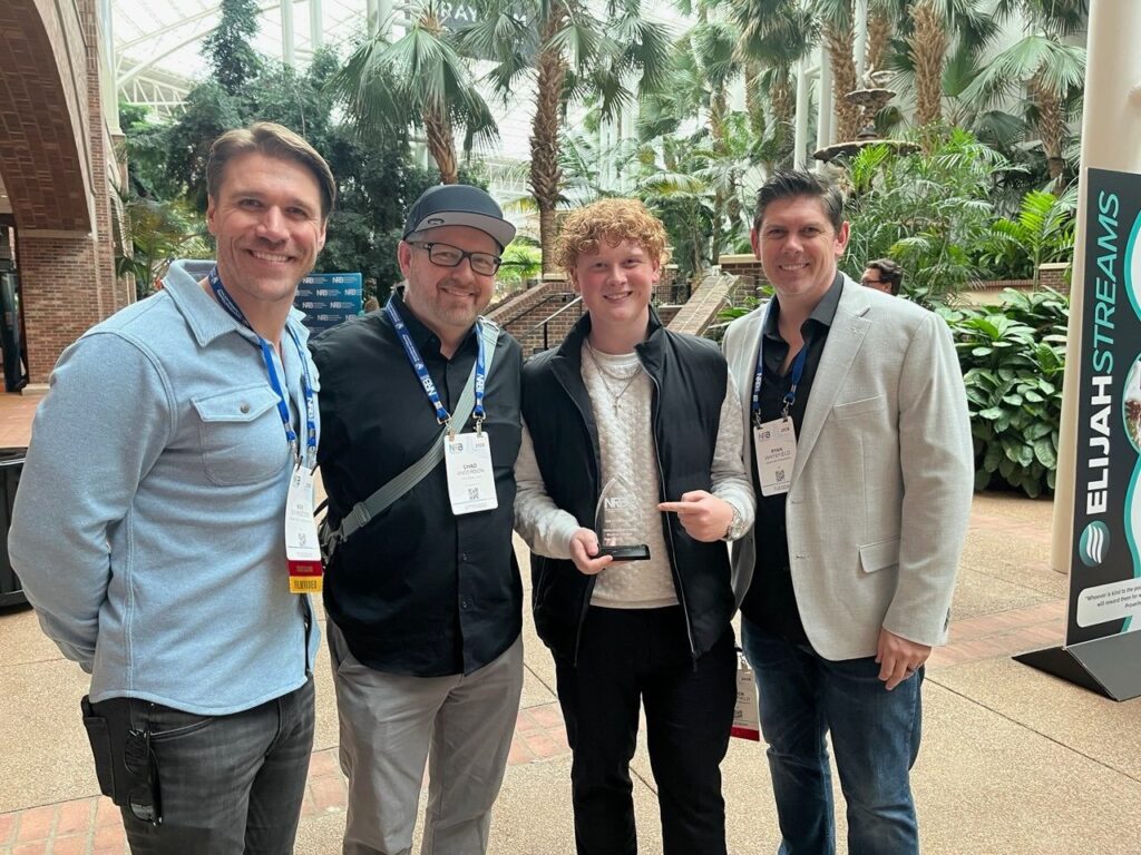 Chad J.W. Anderson with the team at NRB